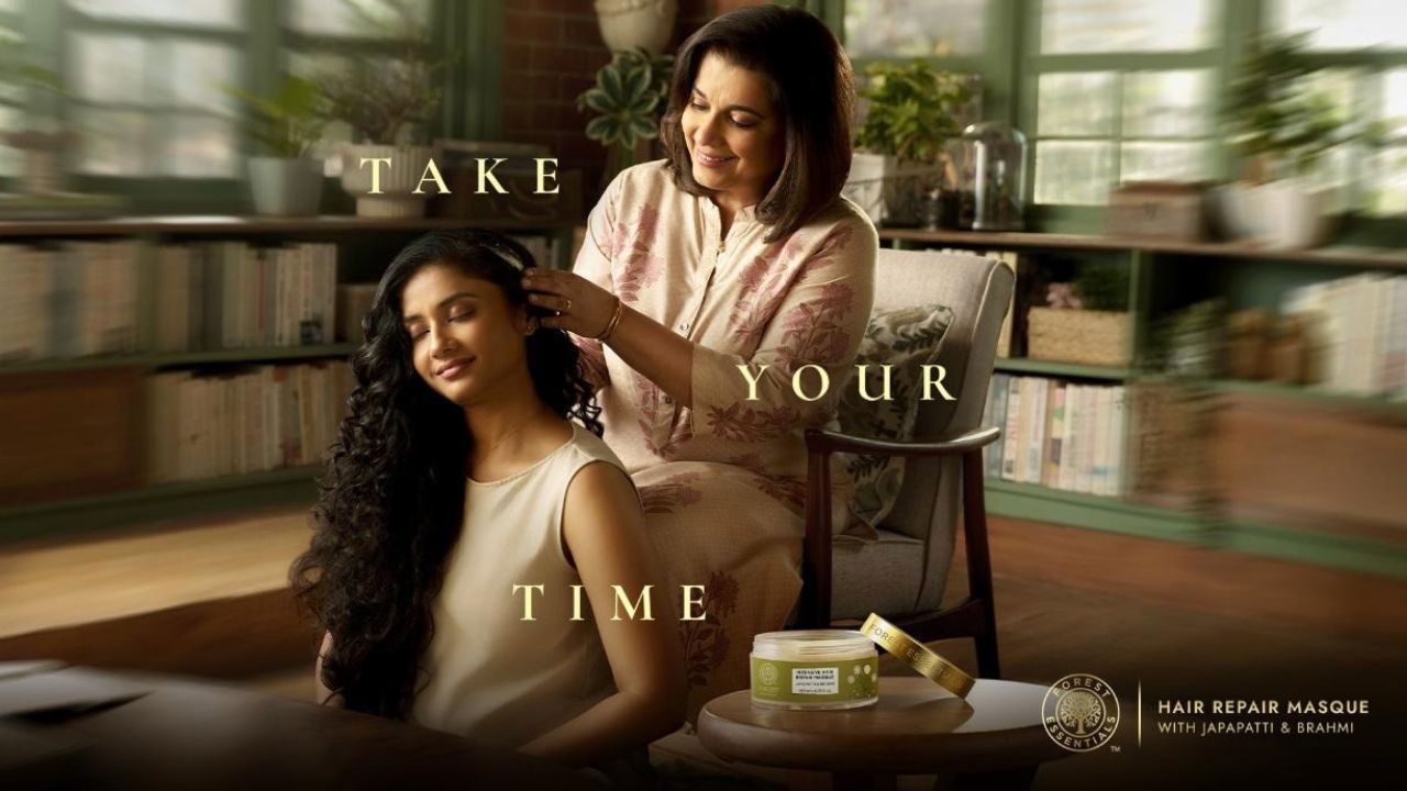 How Forest Essentials Turned Self-Care Into a Premium Experience—mother gently combing daughter’s hair in a warm, serene home setting reflecting mindful self-care