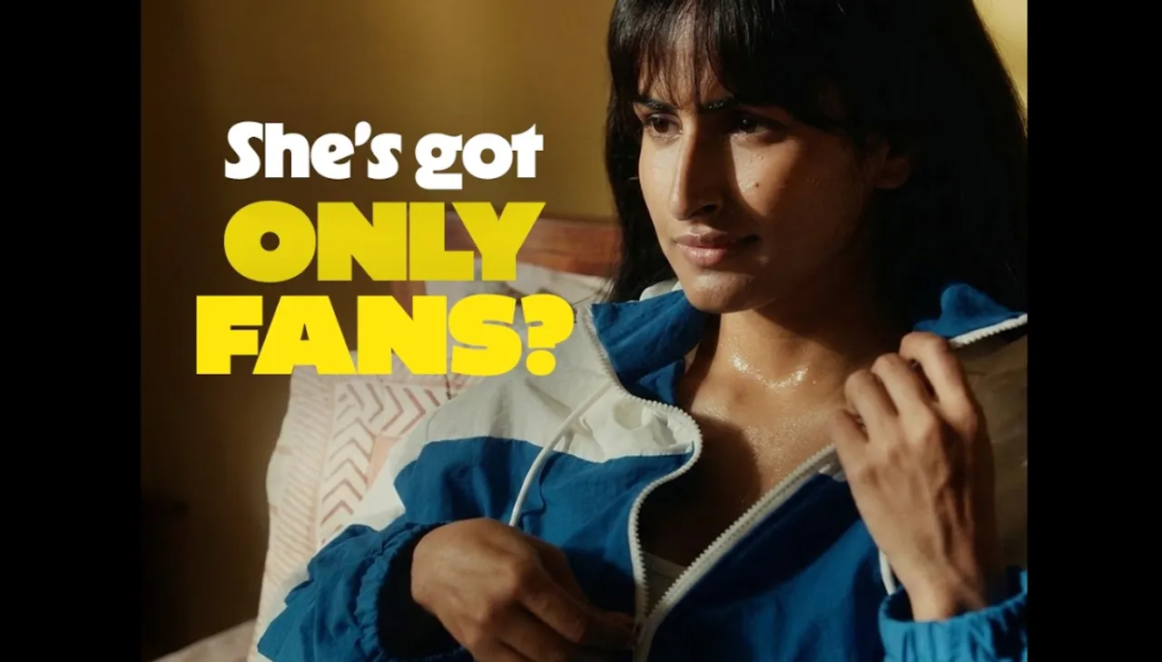 Woman in a blue jacket looking concerned with bold text “She’s got OnlyFans?” highlighting how Flipkart used awkward humor to make a simple product stand out