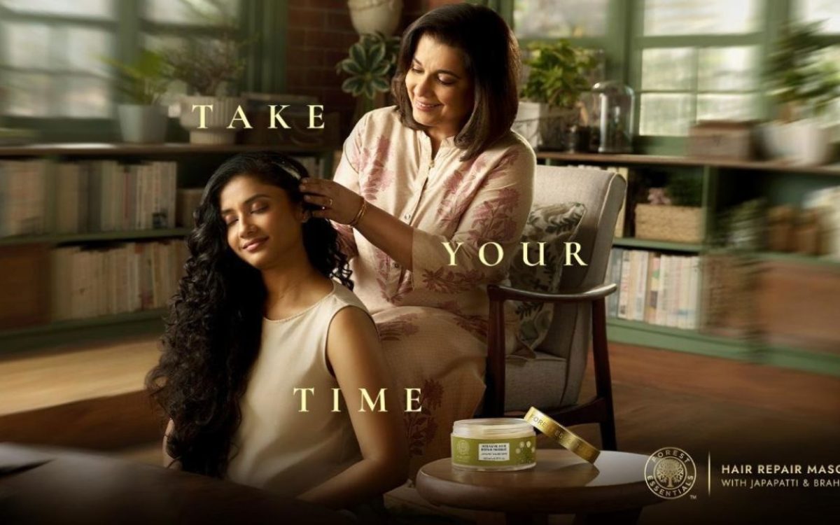 How Forest Essentials Turned Self-Care Into a Premium Experience—mother gently combing daughter’s hair in a warm, serene home setting reflecting mindful self-care