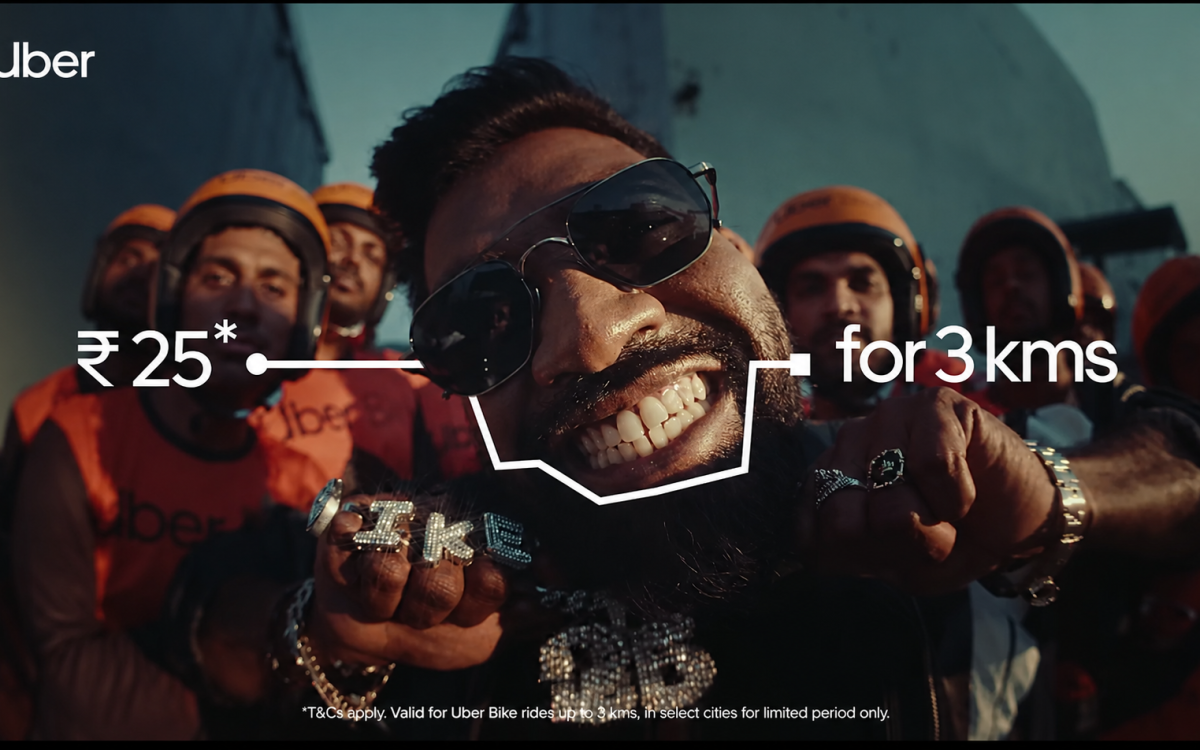 Uber Bike promotional campaign featuring a stylish rider with delivery partners in the background, highlighting the creative strategy that made Uber Bike stand out online with a ₹25 ride offer for 3 kms.