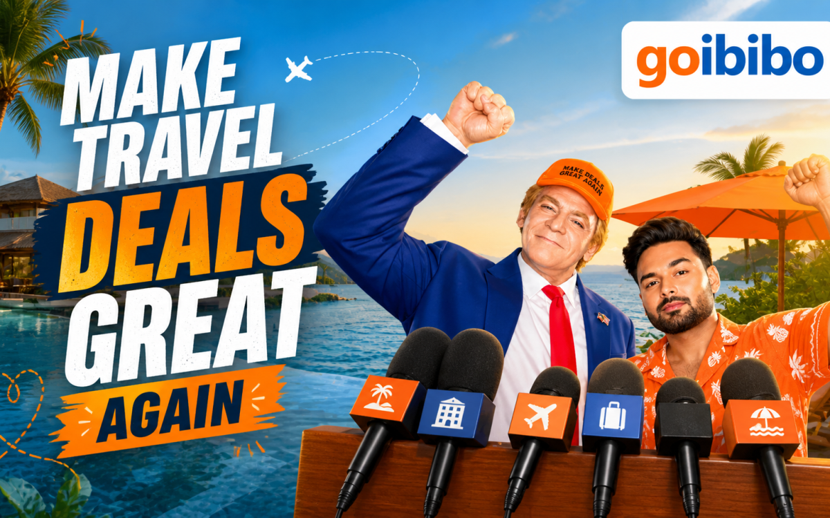 Breaking Down Goibibo’s Viral Ad: Humor, Hype & Smart Strategy featuring a press conference parody with two men raising fists, set against a tropical beach backdrop with bold travel deals messaging