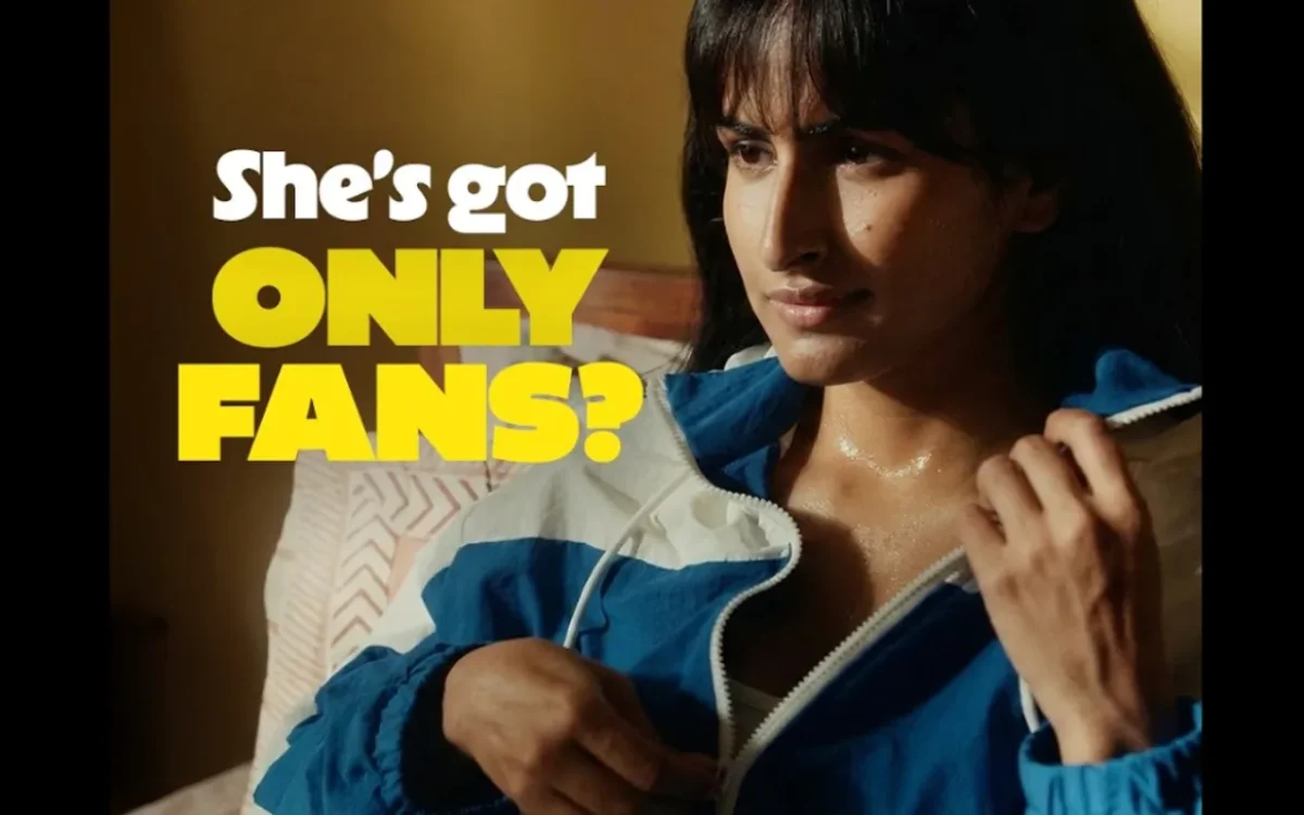 Woman in a blue jacket looking concerned with bold text “She’s got OnlyFans?” highlighting how Flipkart used awkward humor to make a simple product stand out